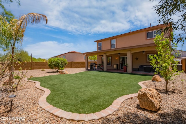 14570 S Sumac Dr, Sahuarita, AZ 85629 - rear view of house with stucco siding, a ceiling fan, and a patio area