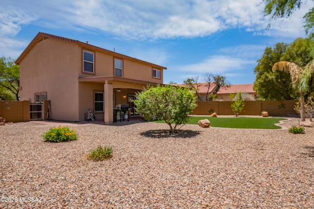 14570 S Sumac Dr, Sahuarita, AZ 85629 - rear view of property featuring stucco siding, a fenced backyard, and a patio area