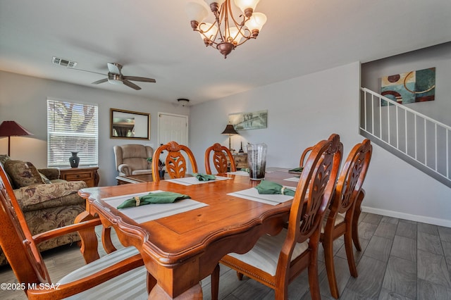 14570 S Sumac Dr, Sahuarita, AZ 85629 - dining space featuring stairway, ceiling fan, a chandelier, wood finished floors, and baseboards
