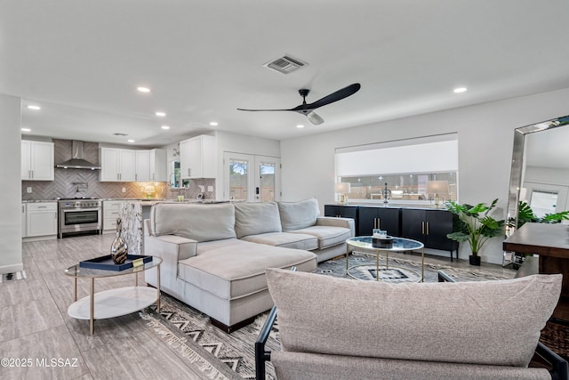 3454 E Calle Del Prado, Tucson, AZ 85716 - living room with recessed lighting, ceiling fan, and light wood-style flooring