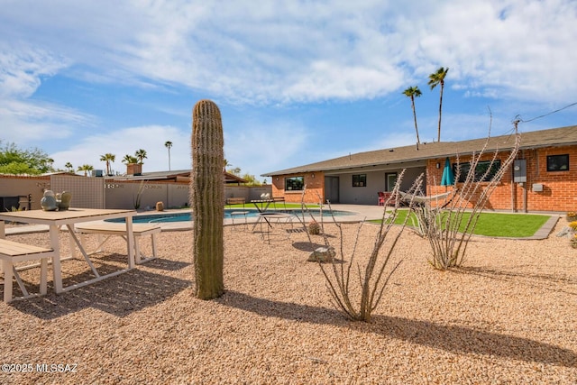 3454 E Calle Del Prado, Tucson, AZ 85716 - back of property with a patio area and brick siding