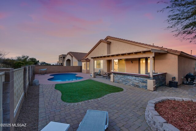 14024 E Fairway Bluff Ct, Vail, AZ 85641 - rear view of property featuring stucco siding, a patio area, a fenced backyard, and a tile roof