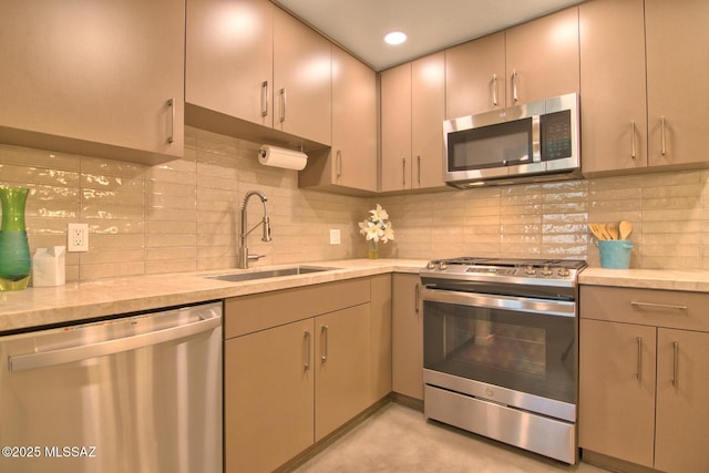 3341 E 23rd St, Tucson, AZ 85713 - kitchen featuring appliances with stainless steel finishes, a sink, light countertops, backsplash, and recessed lighting