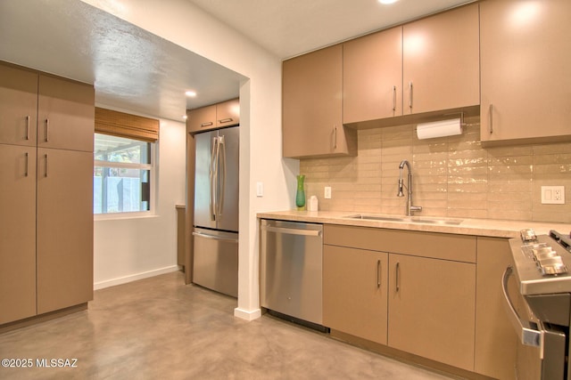3341 E 23rd St, Tucson, AZ 85713 - kitchen with stainless steel appliances, a sink, backsplash, light countertops, and finished concrete floors