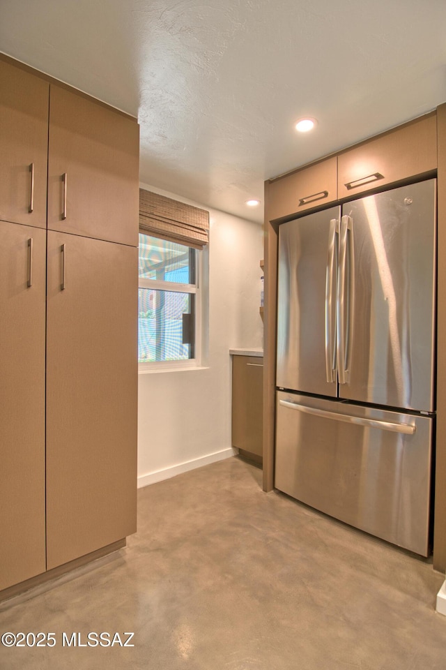 3341 E 23rd St, Tucson, AZ 85713 - kitchen featuring stainless steel refrigerator, finished concrete flooring, baseboards, and recessed lighting