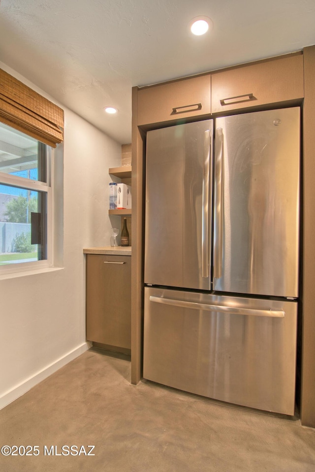 3341 E 23rd St, Tucson, AZ 85713 - kitchen featuring freestanding refrigerator, baseboards, recessed lighting, and finished concrete floors