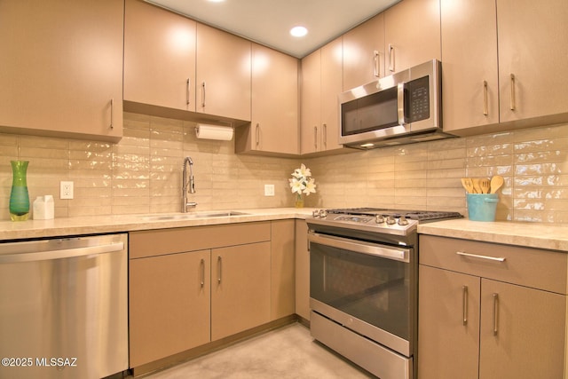 3341 E 23rd St, Tucson, AZ 85713 - kitchen featuring stainless steel appliances, a sink, light countertops, and backsplash