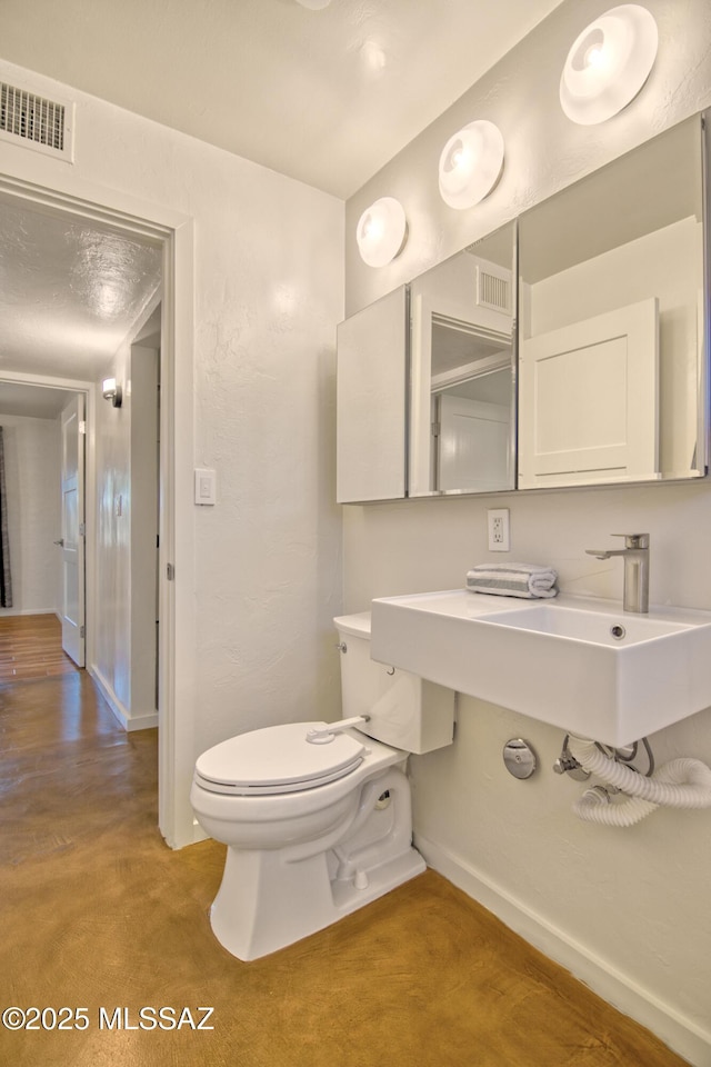 3341 E 23rd St, Tucson, AZ 85713 - half bath featuring toilet and baseboards