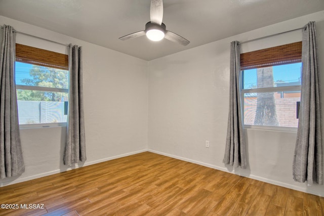 3341 E 23rd St, Tucson, AZ 85713 - empty room featuring plenty of natural light, light wood-style flooring, and ceiling fan