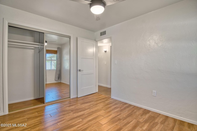 3341 E 23rd St, Tucson, AZ 85713 - unfurnished bedroom featuring light wood-type flooring, baseboards, a closet, and a ceiling fan