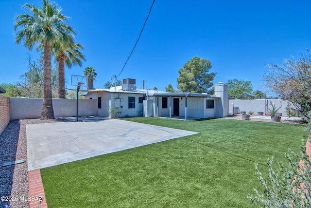 3341 E 23rd St, Tucson, AZ 85713 - rear view of property with central AC and a chimney
