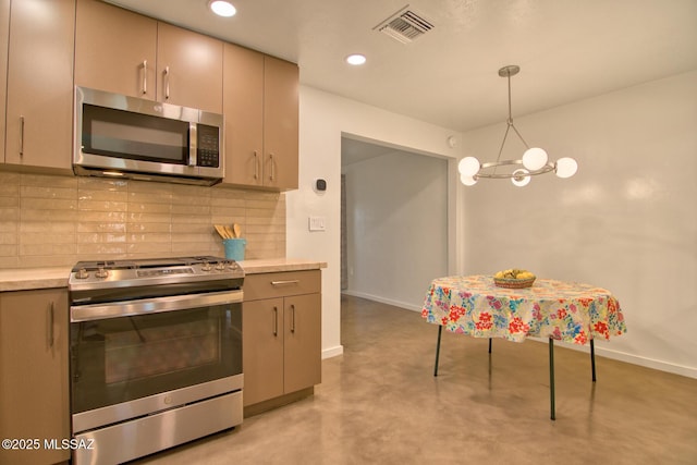 3341 E 23rd St, Tucson, AZ 85713 - kitchen with appliances with stainless steel finishes, decorative backsplash, light countertops, baseboards, and recessed lighting