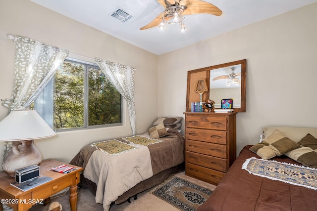 14234 E Placita Niebla, Tucson, AZ 85747 - bedroom with carpet flooring and a ceiling fan