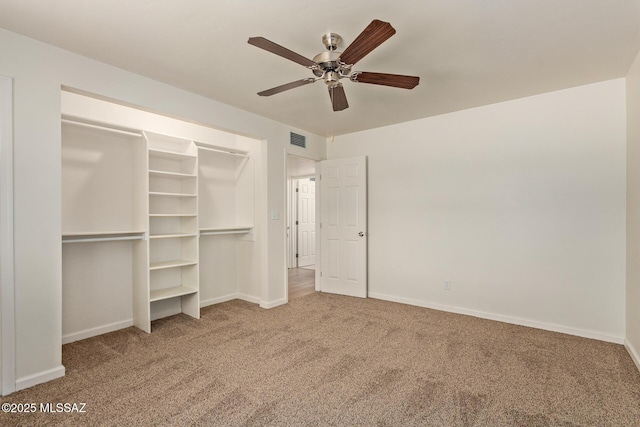 1540 N Calle Valencia, Oracle, AZ 85623 - unfurnished bedroom featuring carpet floors, baseboards, a ceiling fan, and a closet