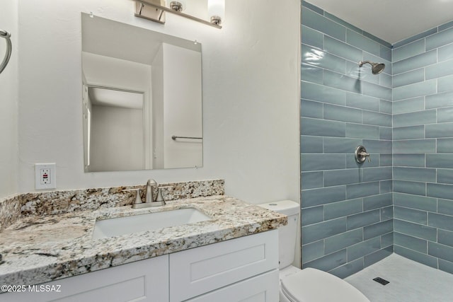 1540 N Calle Valencia, Oracle, AZ 85623 - bathroom featuring a tile shower, toilet, and vanity