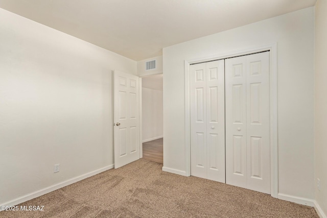 1540 N Calle Valencia, Oracle, AZ 85623 - unfurnished bedroom featuring carpet flooring, baseboards, and a closet