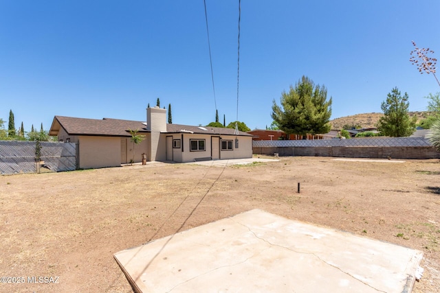 1540 N Calle Valencia, Oracle, AZ 85623 - back of property with a patio area, a fenced backyard, and a chimney