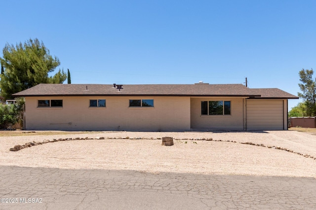1540 N Calle Valencia, Oracle, AZ 85623 - view of front of home featuring a garage, driveway, and brick siding