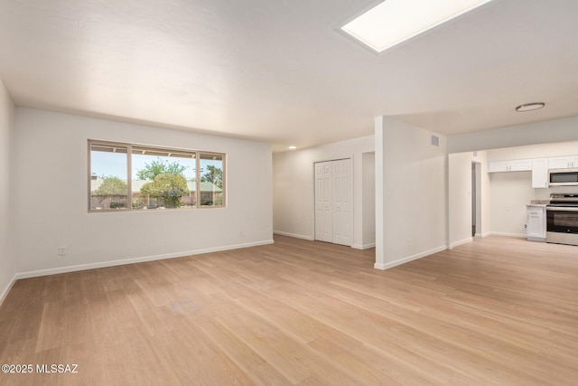 1540 N Calle Valencia, Oracle, AZ 85623 - spare room featuring light wood-style floors and baseboards