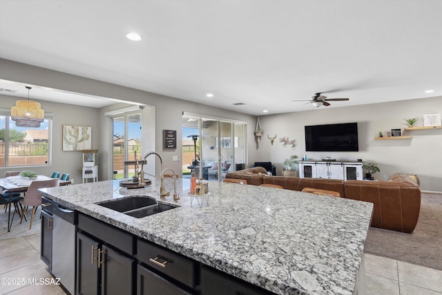 9693 N Melandra Way, Marana, AZ 85653 - kitchen with a sink, light tile patterned floors, recessed lighting, stainless steel dishwasher, and a ceiling fan