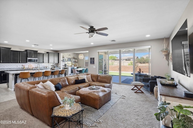 9693 N Melandra Way, Marana, AZ 85653 - living room featuring a ceiling fan, light carpet, and recessed lighting
