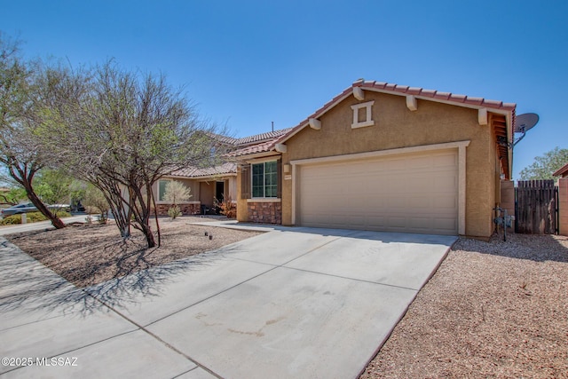 6837 W Leeward Cove Way, Tucson, AZ 85757 - view of front of property with driveway, an attached garage, stucco siding, fence, and a tiled roof