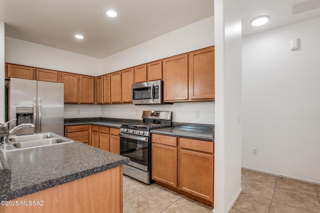 6837 W Leeward Cove Way, Tucson, AZ 85757 - kitchen with appliances with stainless steel finishes, a sink, light tile patterned flooring, dark countertops, and recessed lighting