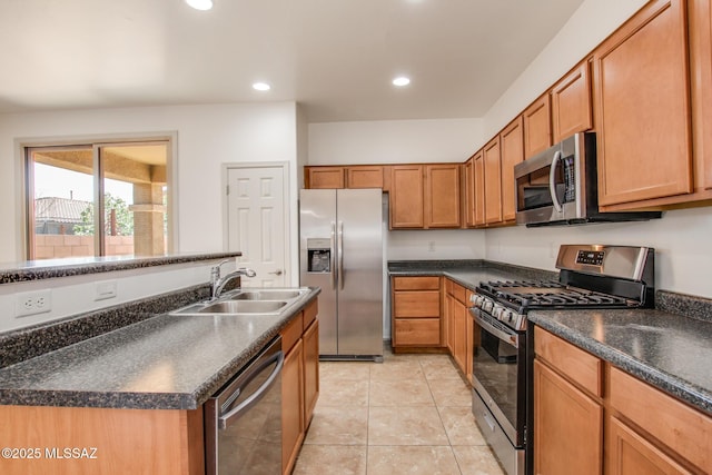 6837 W Leeward Cove Way, Tucson, AZ 85757 - kitchen with appliances with stainless steel finishes, a sink, dark countertops, recessed lighting, and brown cabinetry