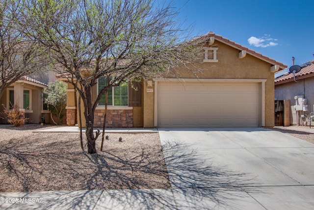 6837 W Leeward Cove Way, Tucson, AZ 85757 - view of front of home with stucco siding, driveway, a garage, and a tiled roof