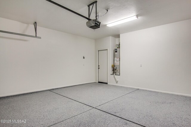 6837 W Leeward Cove Way, Tucson, AZ 85757 - garage with a garage door opener, gas water heater, and baseboards