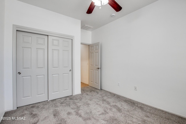6837 W Leeward Cove Way, Tucson, AZ 85757 - unfurnished bedroom featuring carpet flooring, a closet, and a ceiling fan