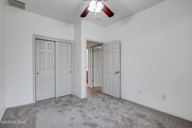 6837 W Leeward Cove Way, Tucson, AZ 85757 - unfurnished bedroom featuring carpet, a closet, and ceiling fan