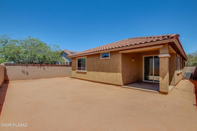 6837 W Leeward Cove Way, Tucson, AZ 85757 - rear view of property featuring stucco siding, a tiled roof, a patio, and a fenced backyard