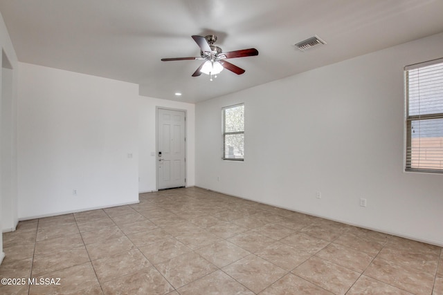 6837 W Leeward Cove Way, Tucson, AZ 85757 - empty room featuring a ceiling fan and light tile patterned flooring