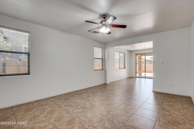 6837 W Leeward Cove Way, Tucson, AZ 85757 - empty room with ceiling fan and light tile patterned floors