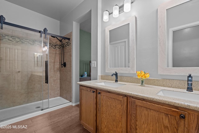 2108 W Moon Milk St, Benson, AZ 85602 - full bathroom featuring a stall shower, double vanity, and wood finished floors