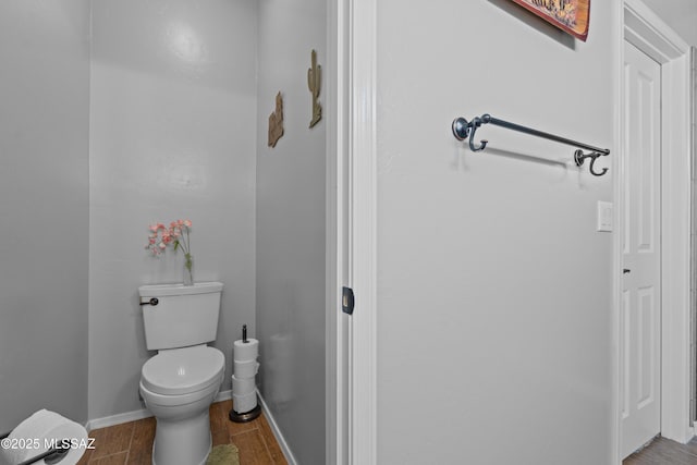 2108 W Moon Milk St, Benson, AZ 85602 - half bath with toilet, wood tiled floors, and baseboards