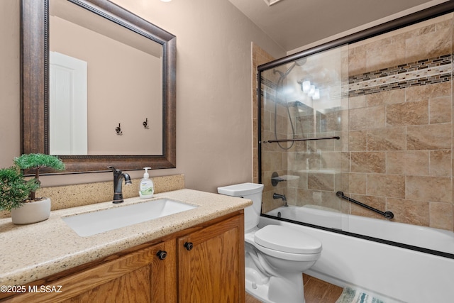 2108 W Moon Milk St, Benson, AZ 85602 - bathroom featuring toilet, vanity, and bath / shower combo with glass door