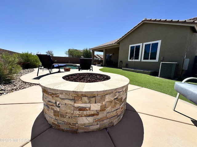 2108 W Moon Milk St, Benson, AZ 85602 - view of patio / terrace with an outdoor fire pit, fence, and central AC