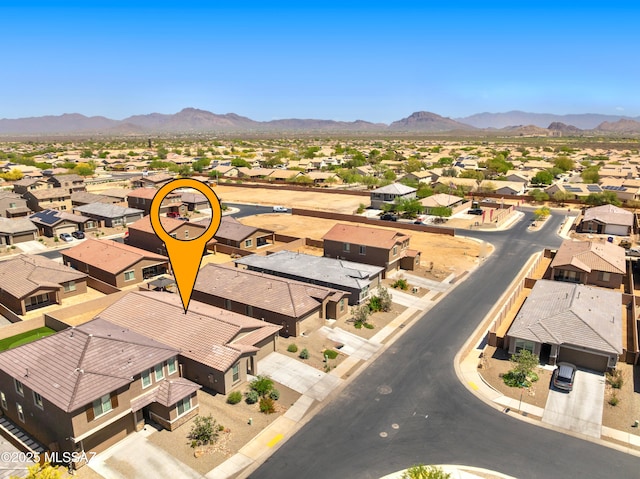 aerial perspective of suburban area with a mountainous background