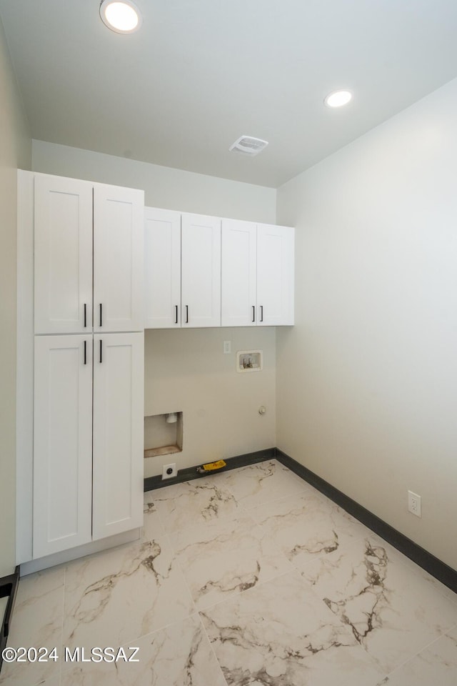 1920 W Pueblo Vista Blvd, Tucson, AZ 85713 - laundry area with cabinet space, hookup for a washing machine, recessed lighting, hookup for an electric dryer, and light marble finish floors