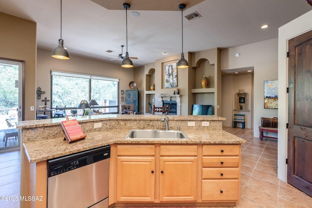 124 Circulo Vespucci, Tubac, AZ 85646 - kitchen with stainless steel dishwasher, a sink, open floor plan, a ceiling fan, and light tile patterned floors