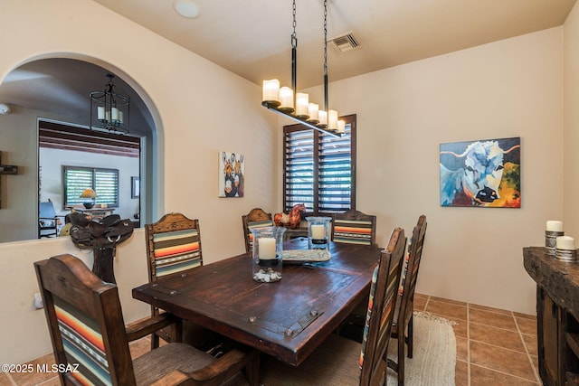 124 Circulo Vespucci, Tubac, AZ 85646 - dining space with arched walkways and a chandelier