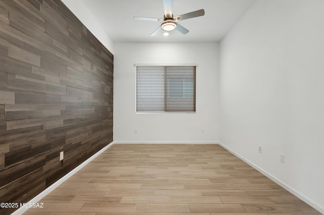 12513 Denton Way, Marana, AZ 85653 - unfurnished room with ceiling fan, light wood-style floors, and baseboards