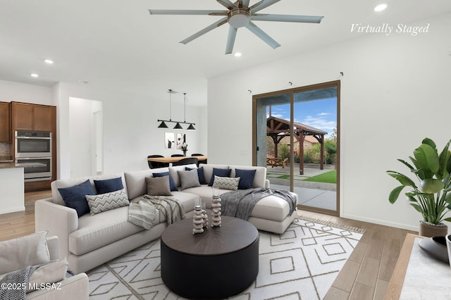 12513 Denton Way, Marana, AZ 85653 - living room with light wood-type flooring, ceiling fan, recessed lighting, and baseboards