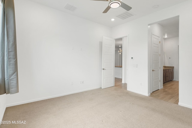 12513 Denton Way, Marana, AZ 85653 - unfurnished bedroom featuring light carpet, baseboards, ensuite bath, recessed lighting, and a ceiling fan