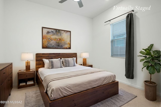 12513 Denton Way, Marana, AZ 85653 - bedroom with light colored carpet, baseboards, and ceiling fan