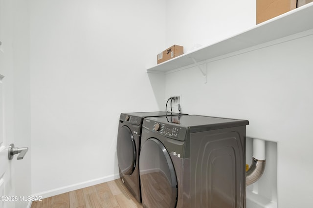 12513 Denton Way, Marana, AZ 85653 - washroom featuring washer and dryer, light wood-style flooring, and baseboards