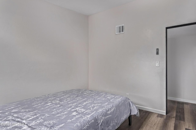 1025 E Windsor St, Tucson, AZ 85719 - bedroom with wood finished floors and baseboards