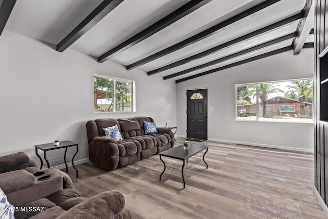 1025 E Windsor St, Tucson, AZ 85719 - living area with beamed ceiling, baseboards, and light wood-style floors